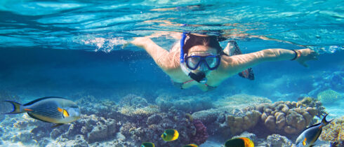 Young women at snorkeling in the tropical water